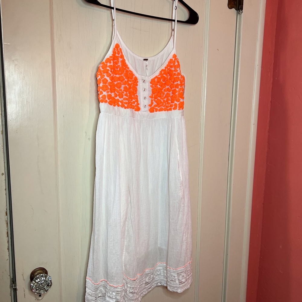 Free people dress orange and white. Size L.